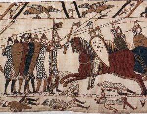 Norman cavalry attacking the English shield wall, from the Bayeux Tapestry