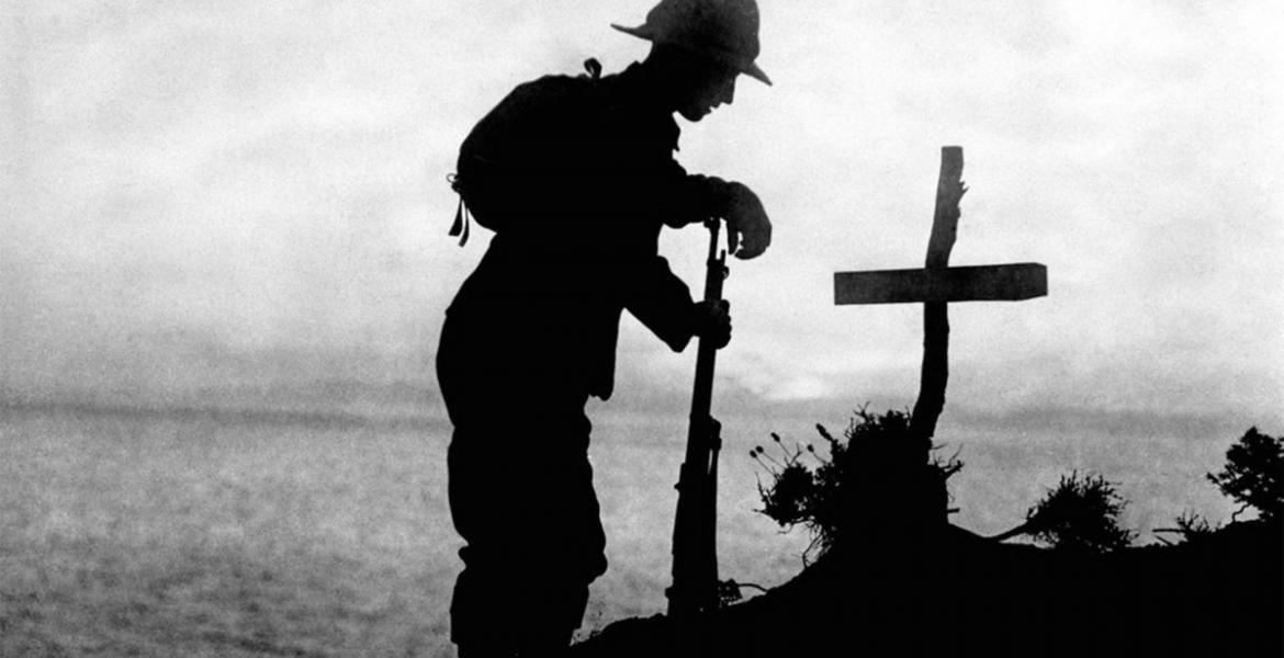Soldier by a cross in WWI
